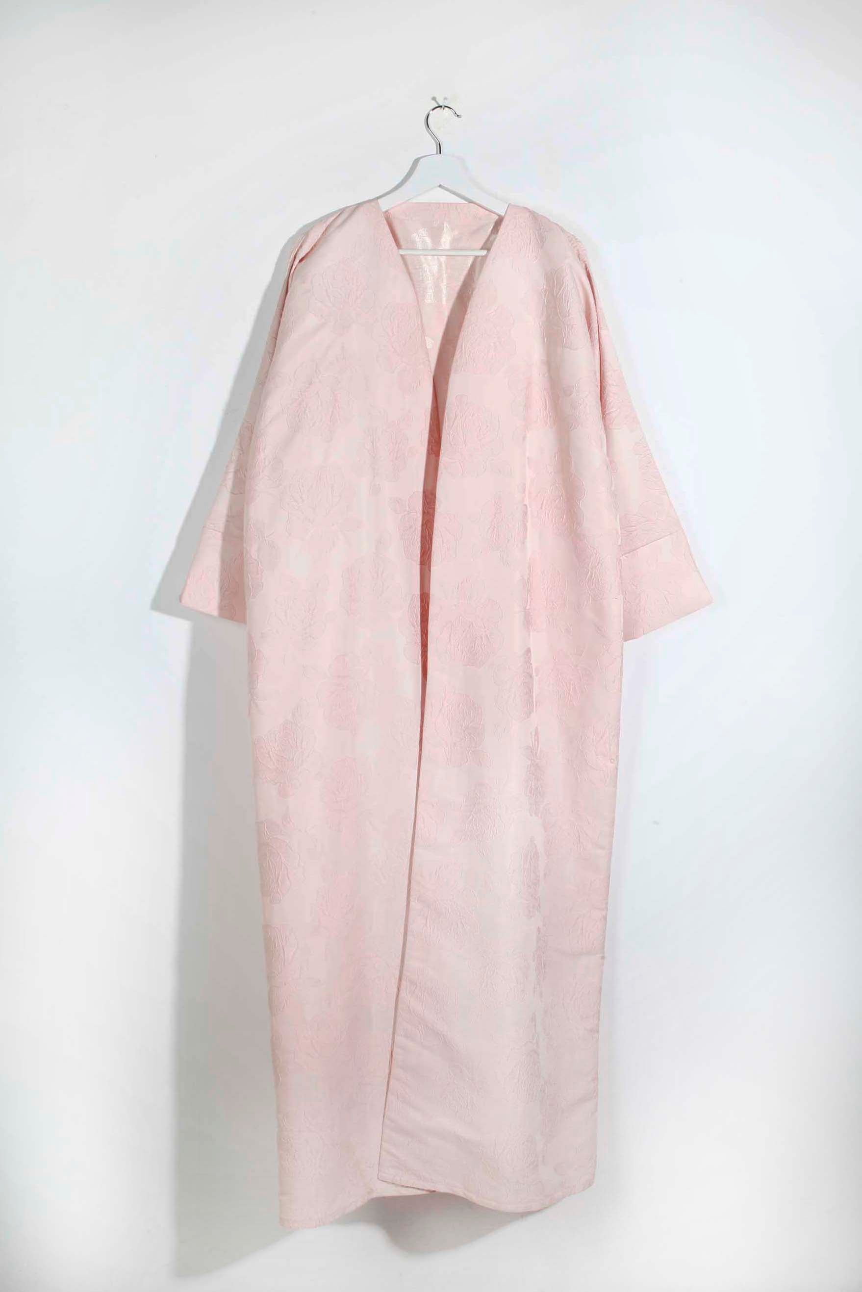 Pale pink abaya with floral pattern