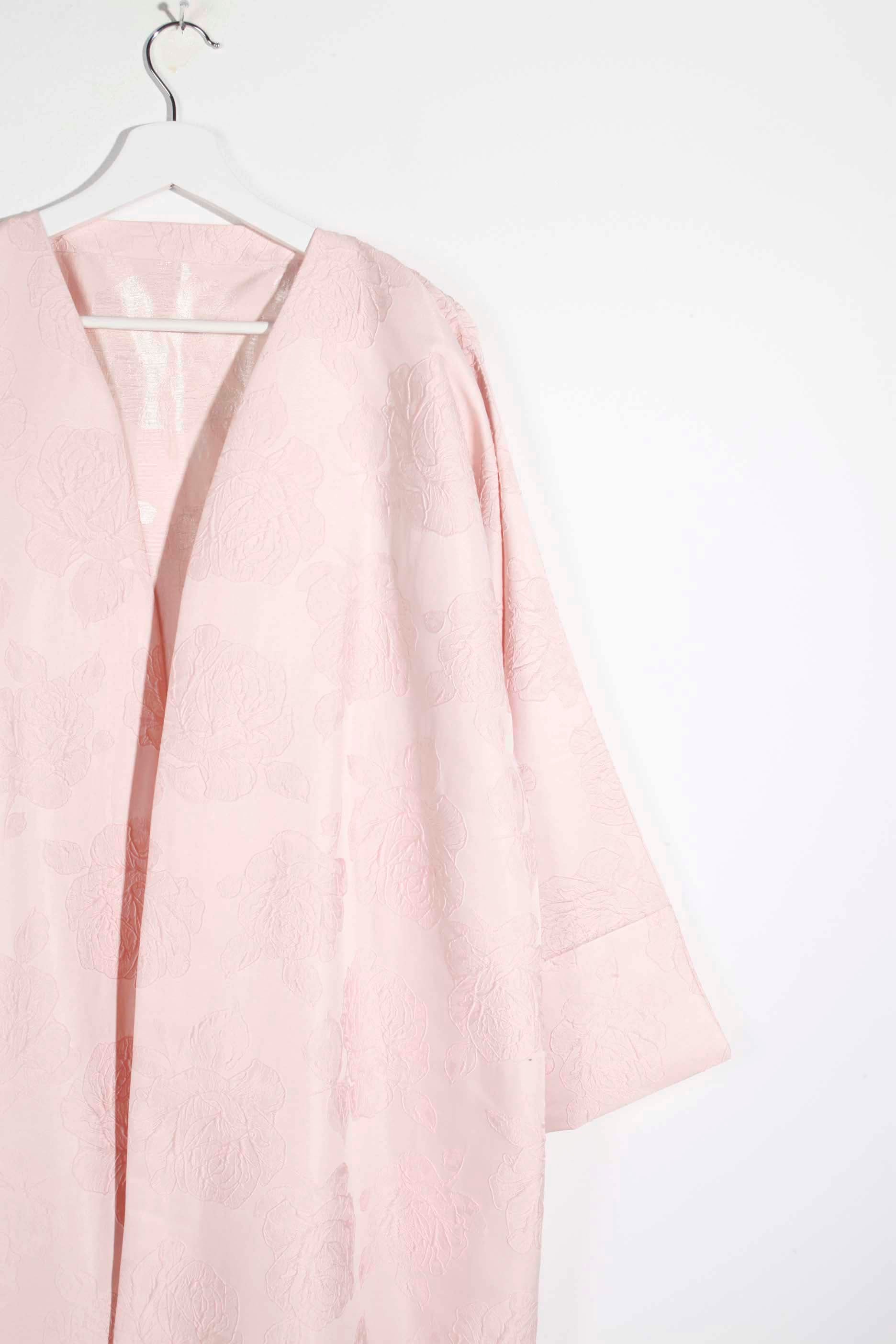 Pale pink abaya with floral pattern